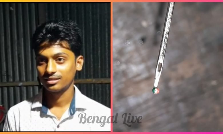 indian national flag drawn on poppy seed by a youth of raiganj