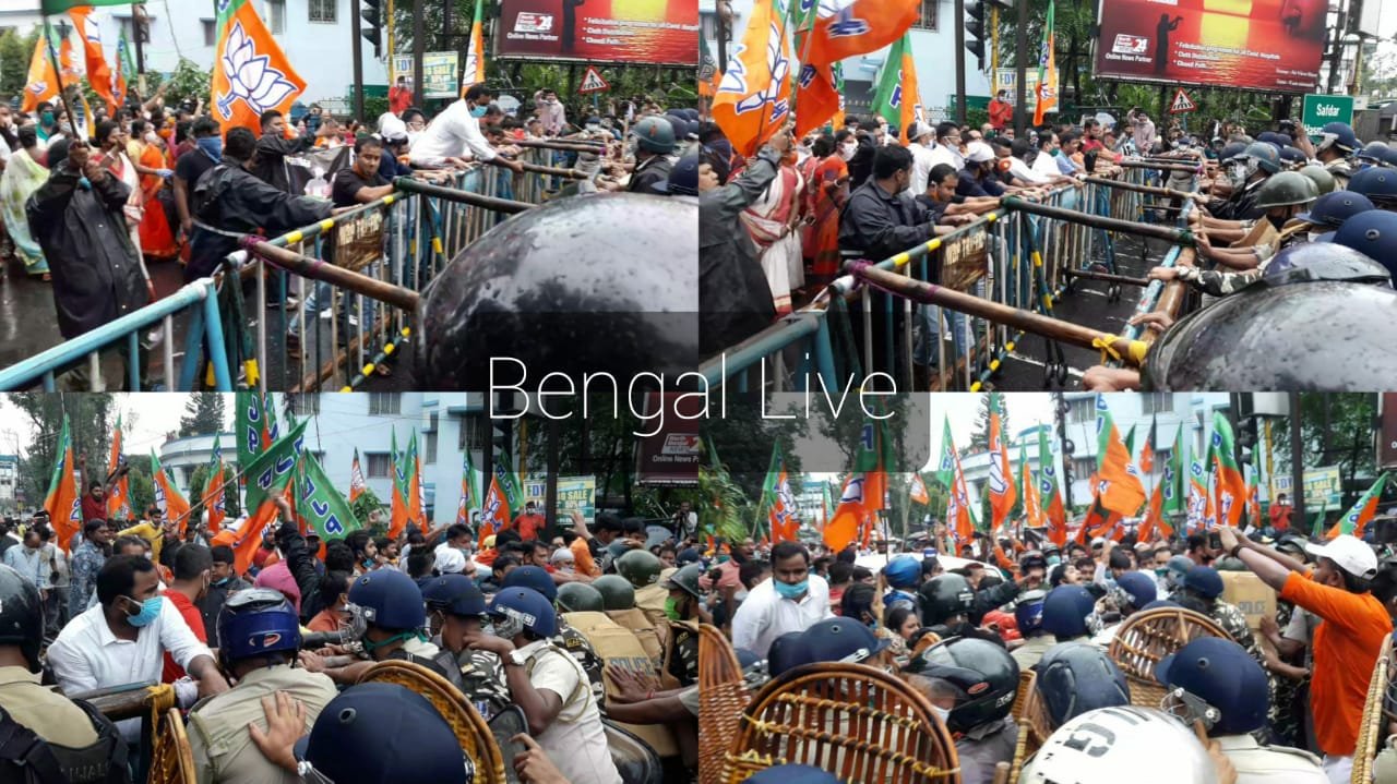 police involves in tug of war while bjp workers trying to break the barricade in siliguri